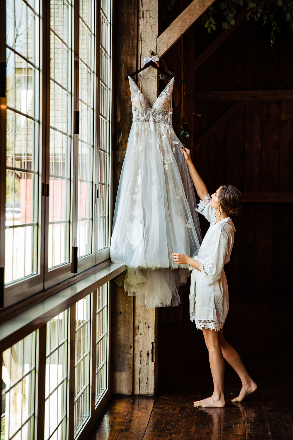 A woman looking at her wedding dress